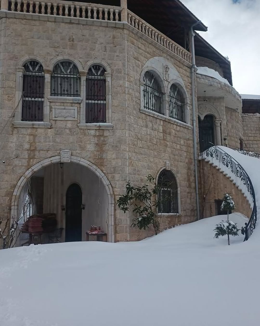 Traditional Lebanese stone architecture with red tile roof